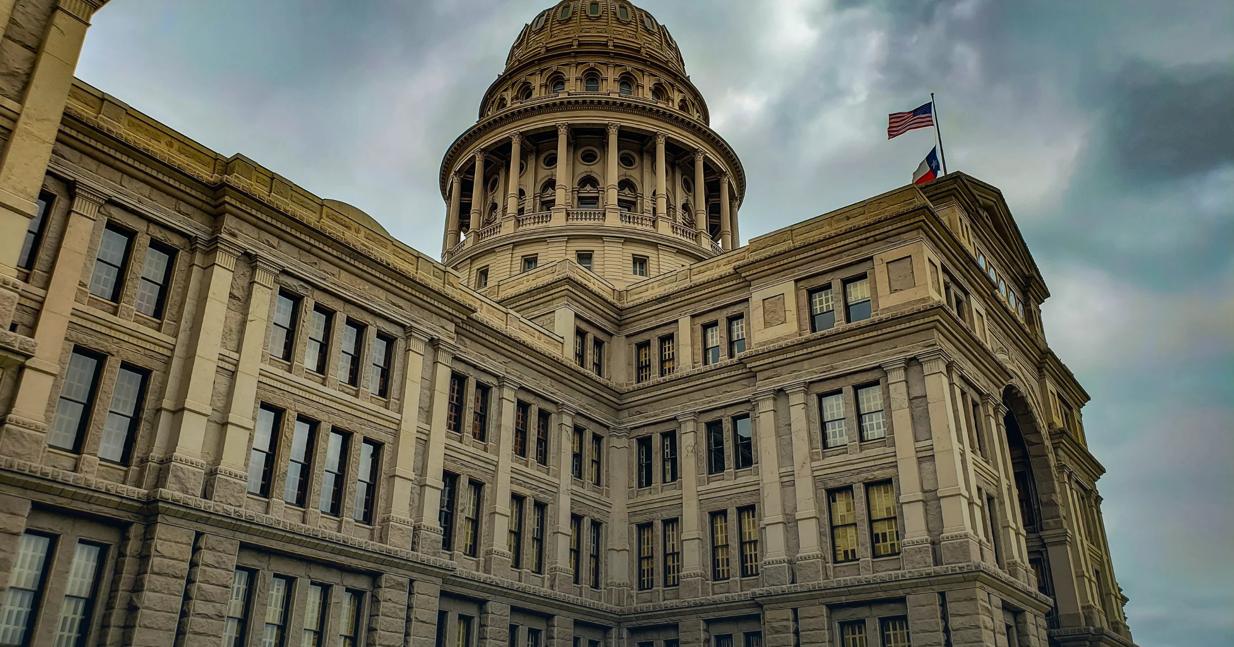The Texas State Capitol building in Austin under cloudy sky